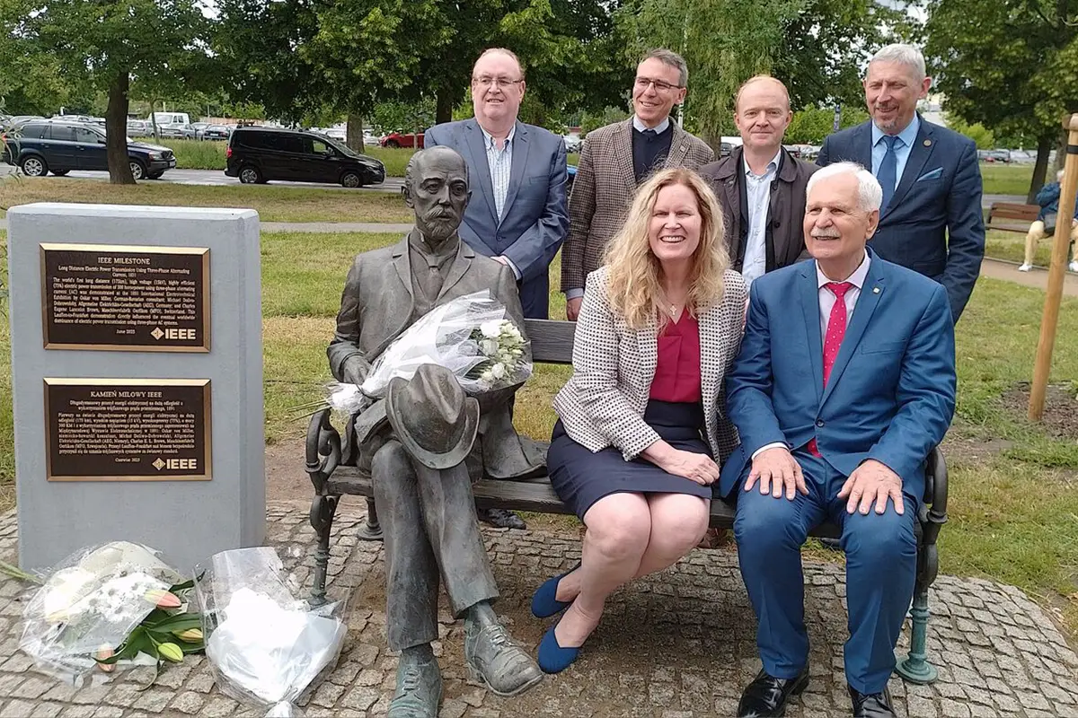 IEEE President Kathleen Kramer (center) with representatives during a ceremony in Poland commemorating the Long Distance Electric Power Transmission Using Three-Phase Alternating Current Milestone, which influenced electric power transmission.