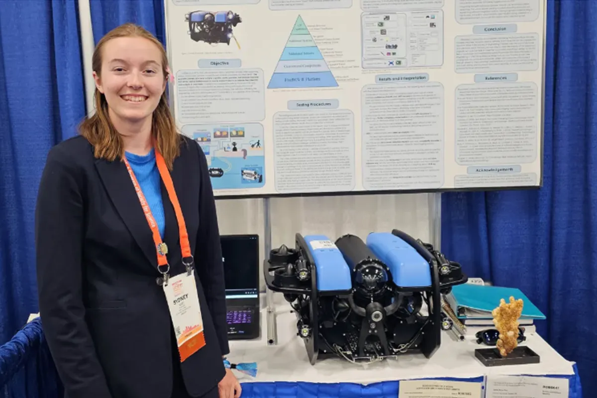 IEEE Presidents’ Scholarship recipient Sydney West with her remotely operated vehicle, Cnidaria, which is designed to help preserve and sustain coral reefs